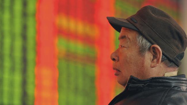 A Chinese stock investor monitors prices at a brokerage house in Fuyang in central China's Anhui province Thursday, Jan. 21, 2016. Asian stock markets were mostly in the red Thursday, surrendering early gains as oil drifted lower and sentiment remained fragile following big swings on Wall Street. (Chinatopix via AP) CHINA OUT