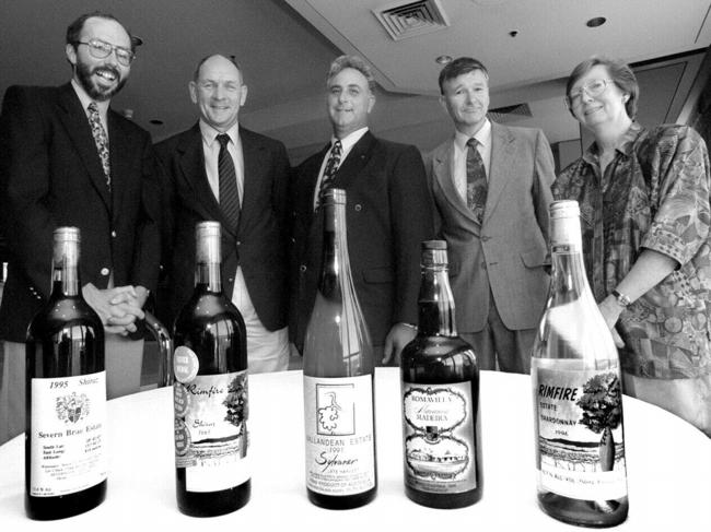 15.11.96 Pic by David/Crosling. Winners of the Qld Wine awards. (L to R) in front of their winning wines are Bruce Humphery-Smith of Severn Brae Estate, Tony Connellan of Rimfire Estate, Angelo Puglisi of Ballandean estate, David Wall of Roma Villa and Margaret Connellan of Rimfire Estate. nov 1996 headshot bottles