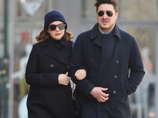 Carey Mulligan and Marcus Mumford walk arm-in-arm in matching navy coats as they stroll though SoHo in NYC two months ago.