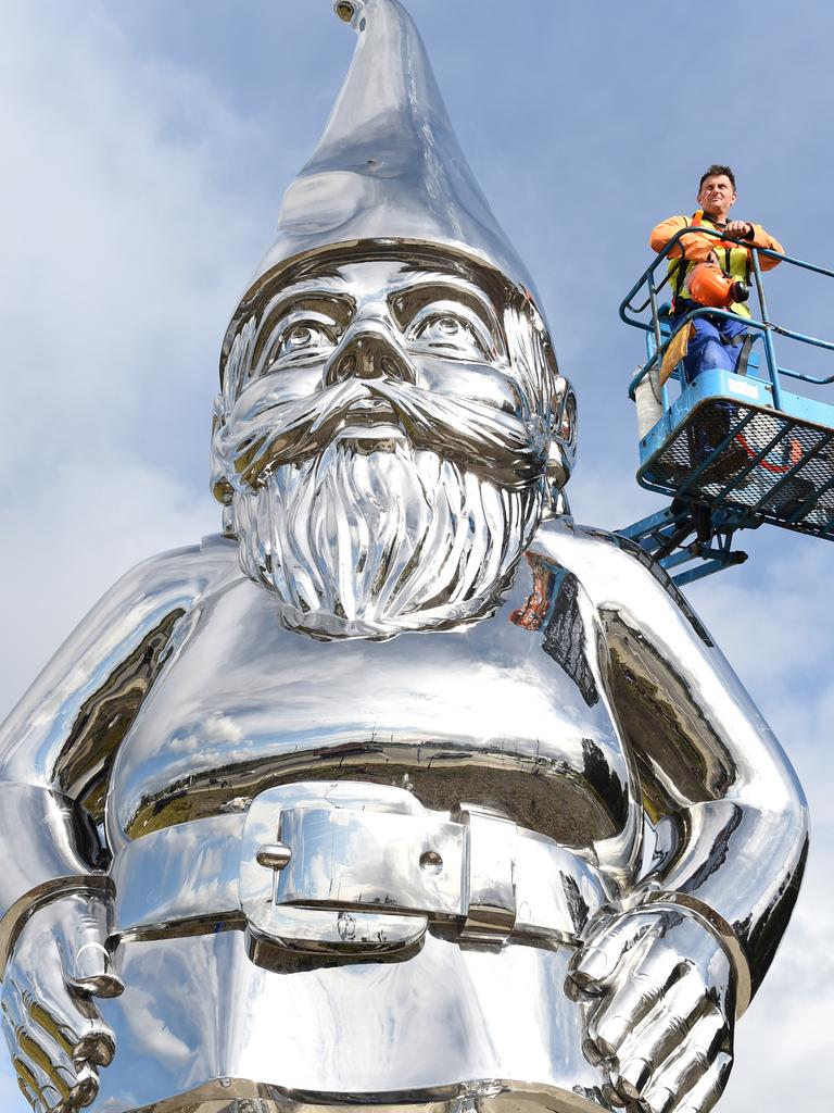 Sculptor Gregor Kregar with his gnome artwork, titled Reflective Lullaby, which stood at the Peninsula Link and Cranbourne Rd intersection before being relocated to the McClelland Sculpture Park and Gallery. Picture: Jason Sammon.