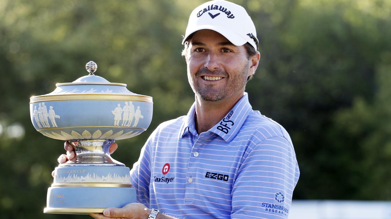 Kevin Kisner poses with his trophy.