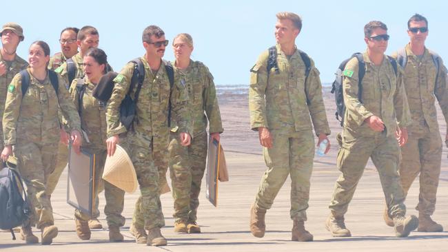 5th Battalion troops making their way across the tarmac at RAAF Base Darwin. Picture: Harry Brill.