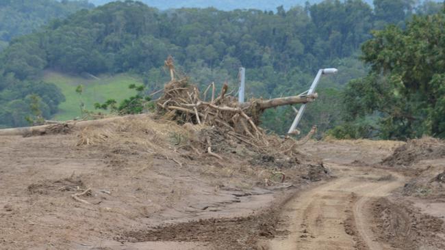 Many power poles were smashed when Daintree River flooded. Picture: Bronwyn Farr