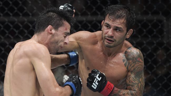 RIO DE JANEIRO, BRAZIL - MAY 04: (R-L) Alexandre Pantoja of Brazil punches Steve Erceg of Australia in a UFC flyweight championship bout during the UFC 301 event at Farmasi Arena on May 04, 2024 in Rio de Janeiro, Brazil.  (Photo by Alexandre Loureiro/Zuffa LLC via Getty Images)