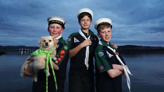 James Patterson, 12, left, and brother Nicky Patterson, 11, right, with their dog Molly, a Tibetan spaniel cross dog, and Harry Followes, 12, centre, all members of the First Derwent Sea Scouts.  Picture: NIKKI DAVIS-JONES