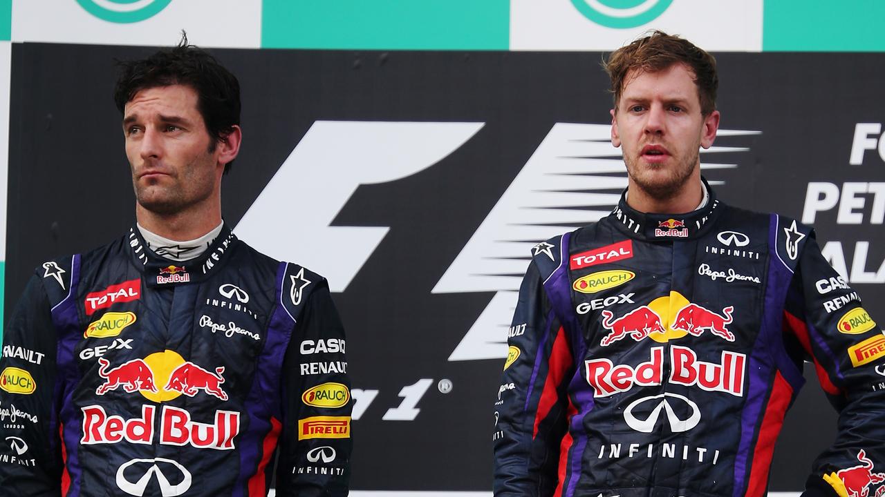 Mark Webber and Sebastian Vettel on the 2013 Malaysian GP podium.