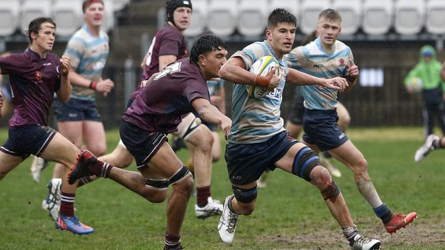 NSW's Charles Cooper with the ball.