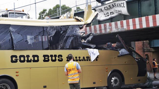 A bus stuck under a bridge on Montague Street on Monday, February 22, 2016, in South Melbourne. Picture: Hamish Blair