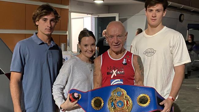 74-year-old boxer Dennis Cherry with his grandkids, Isaac, Amelie and Jesse.