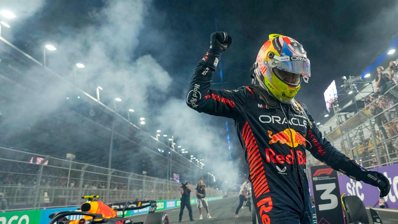 TOPSHOT – Red Bull Racing's Mexican driver Sergio Perez celebrates after winning the Saudi Arabia Formula One Grand Prix at the Jeddah Corniche Circuit in Jeddah on March 19, 2023. (Photo by Luca Bruno / POOL / AFP)