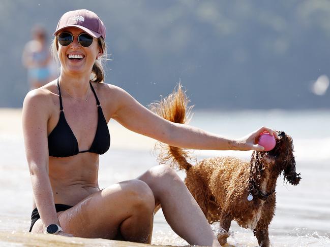 DAILY TELEGRAPH - 15.3.25Hot weather on the Central Coast at Ettalong Beach today. Sophie Wood pictured with her dog Bagel (0433771753).  Picture: Sam Ruttyn