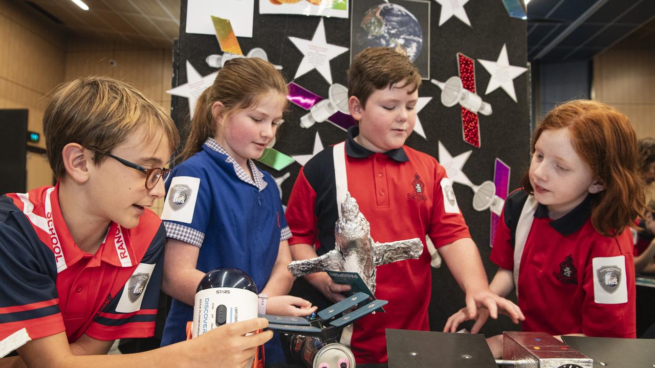 Rangeville State School students of team Wafflemaaa (from left) Felix Wuersching, Mia Hines, Flynn Elsworth and Emily Sheather discuss their satellite project as part of Kids in Space Queensland finals and showcase at Edmund Rice Cultural Centre St Mary's College, Friday, June 7, 2024. Picture: Kevin Farmer