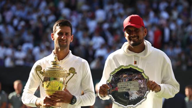 Something to aspire to.... Kyrgios stands alongside seven-time Wimbledon champion Novak Djokovic. Picture: Getty