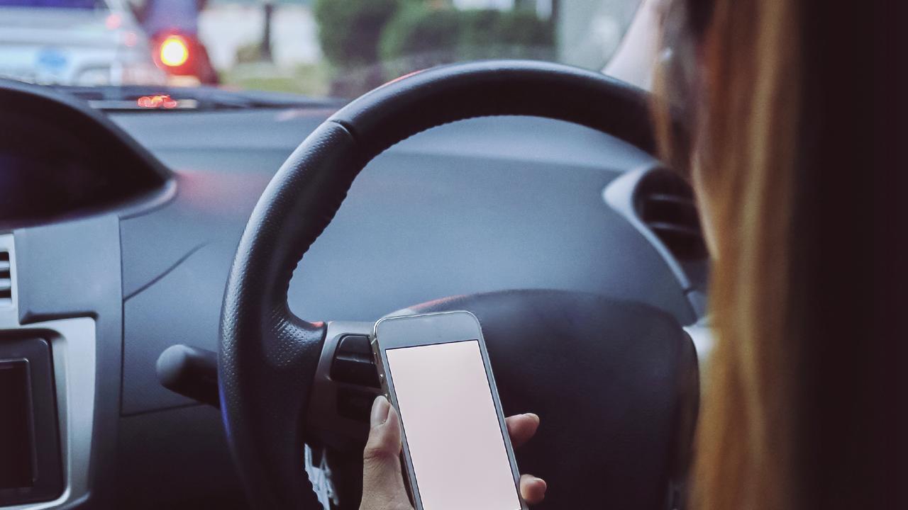 Women using phone while driving. Picture: iStock