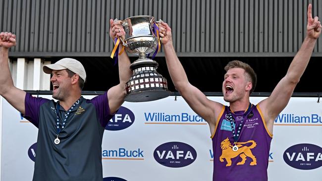 Collegians coach Jared Rivers and captain Sam Hibbins lift the premiership cup. Picture: Andy Brownbill