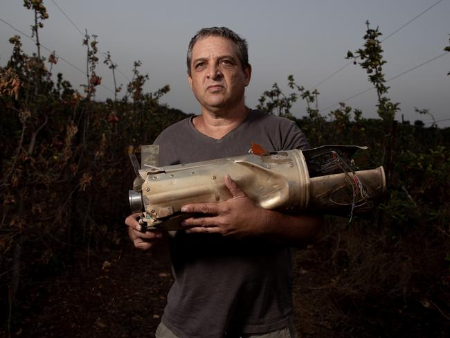 06-07-2024 - Shay Golany with an engine from a Russian 9M133 Kornet anti-tank guided missile found in a cherry field in his kibbutz in early July. Picture: Liam Mendes / The Australian