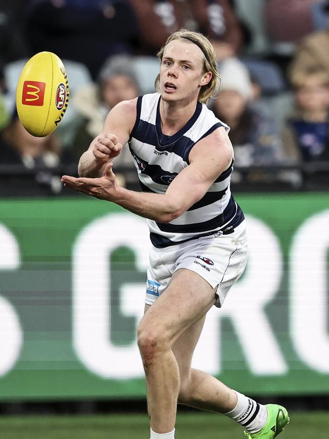 Zach Guthrie fires off a handball. Picture: Martin Keep/AFL Photos via Getty Images