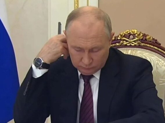 Vladimir Putin's watch is clearly seen on his right wrist but he seemed baffled when looking at the time. Picture: Supplied