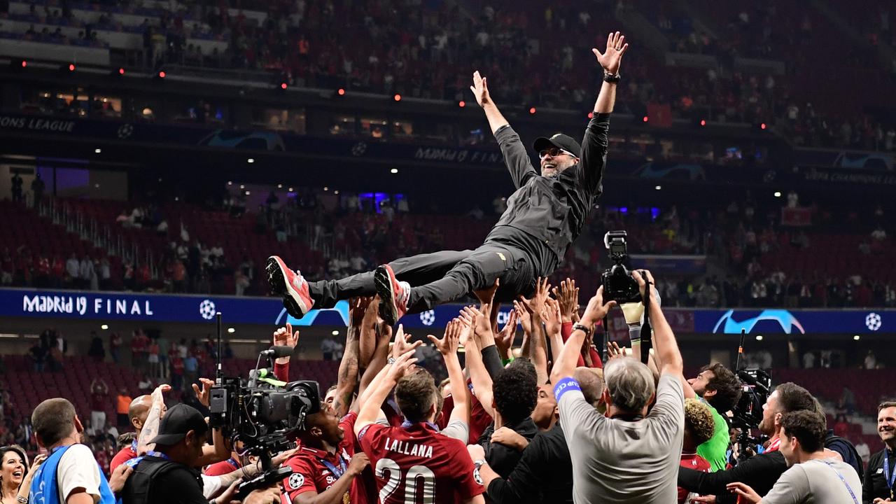 Liverpool's players throw German manager Jurgen Klopp (C) in the air after winning the Champions League final