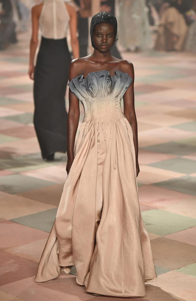 Adut Akech took to the runway for Christian Dior wearing a corsetted silk gown. Picture: Pascal Le Segretain/Getty Images