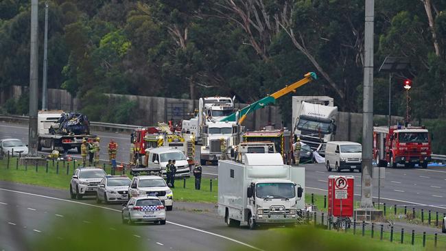 Emergency services crews work at the scene of the collision. Picture: AAP