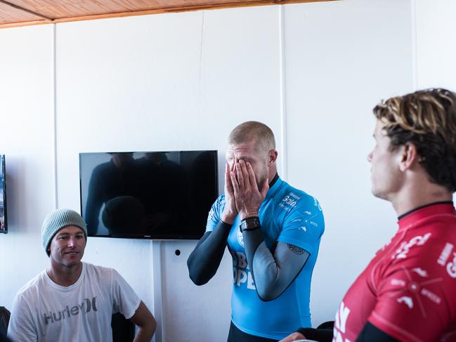 Mick Fanning holds his head in his hands after his shark attack. Picture: Kirstin Scholtz / WSL