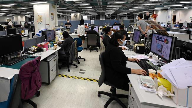 Journalists at work in the newsroom of the Apple Daily newspaper in Hong Kong. Picture: AFP.