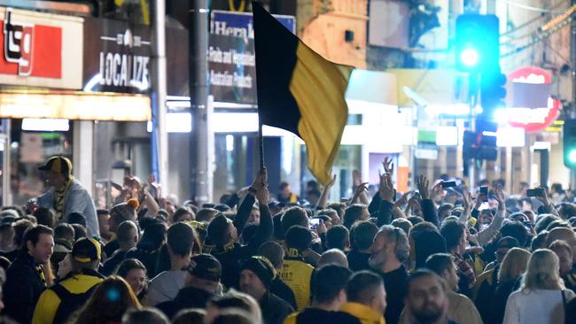 A sea of yellow and black on Swan St. Picture: Tony Gough