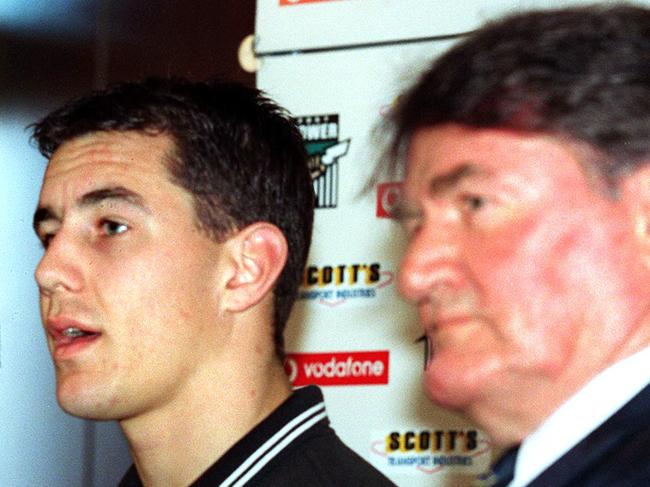 Port Adelaide Power Football Club chief executive Brian Cunningham with footballer Warren Tredrea and Geof Motley at press conference after Tredrea signed long-term contract.