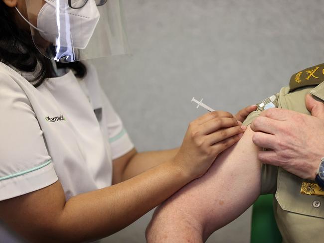 CANBERRA, AUSTRALIANewsWire Photos DECEMBER 14, 2021: The Coordinator General of Operation COVID Shield, Lieutenant General John Frewen received his COVID-19 vaccination booster dose at a local Canberra Pharmacy.Picture: NCA NewsWire / Gary Ramage