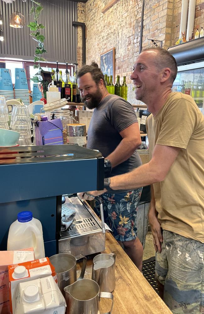 Brendon Thurgate, co-owner of Dark Horse Cafe on Molesworth St in Lismore (right), opened his business after the floods.