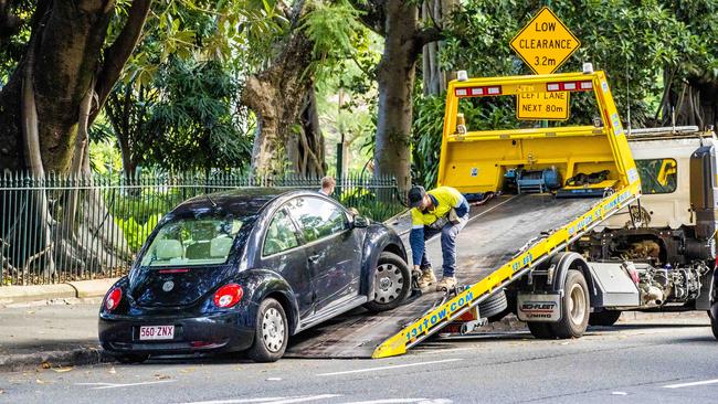 A car being towed from a clearway on Alice St in the CBD. Picture: Richard Walker