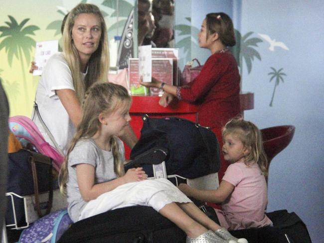 Kelly Landry and her girls arrive in Bali for a break from the attention. Picture: Albert Bachtiar / DIIMEX