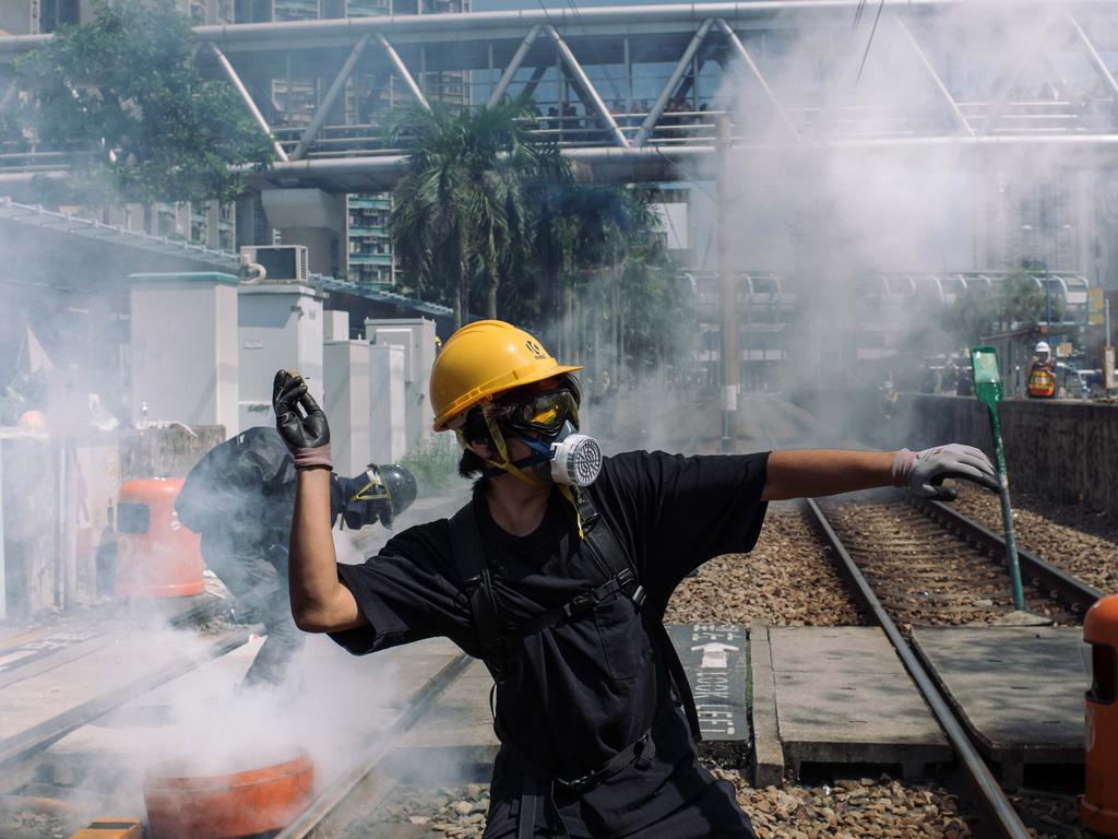 A protester throws a stone towards police outside Tin Shui Wai police station during a protest on August 5 in Hong Kong. Picture: Billy H.C. Kwok/Getty Images