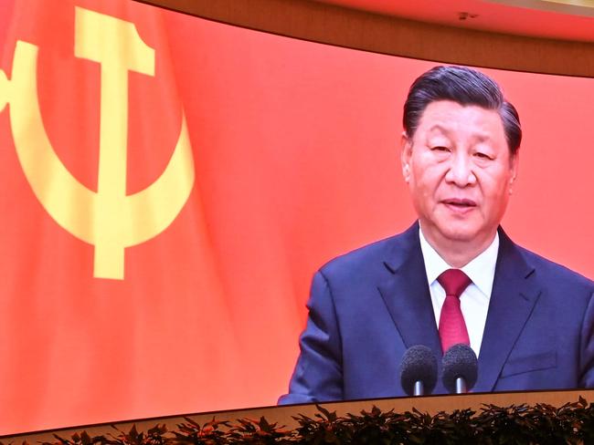 A screen shows images of China's President Xi Jinping as people visit the Museum of the First National Congress of the Chinese Communist Party in Shanghai on February 27, 2025, ahead of the opening of the annual session of the National Peopleâs Congress on March. (Photo by HECTOR RETAMAL / AFP)