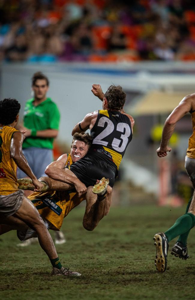 Mitch Musgrove tackles Brodie Filo in the 2023-24 NTFL Men's Grand Final between Nightcliff and St Mary's. Picture: Pema Tamang Pakhrin