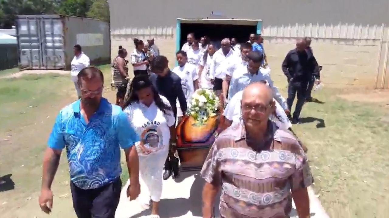 Loved ones carry Jarrad ‘Boyza’ Purcell to the hearse waiting outside the church.