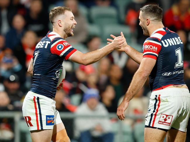 PERTH, AUSTRALIA - AUGUST 02: Sam Walker of the Roosters celebrates his try with his team mates during the round 22 NRL match between Dolphins and Sydney Roosters at HBF Park, on August 02, 2024, in Perth, Australia. (Photo by James Worsfold/Getty Images)