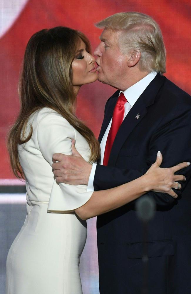 Awkward? Hang on, my mouth is over here, Somewhere. Trump and his missus share an intimate moment. Picture: Jim Watson/AFP