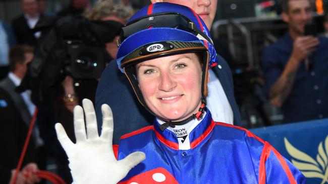 Jamie Kah gives a high five after a day out at Caulfield. Picture: Vince Caligiuri/Getty Images