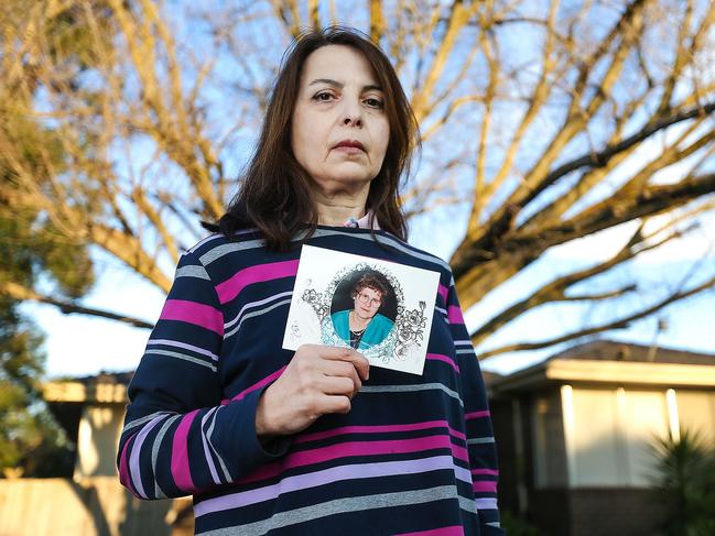 Maxine Tsihlakis holds a photograph of her mother Georgia Mitsinikos who died from coronavirus she contracted from St Basil's. Picture: Ian Currie