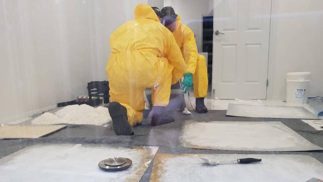 Police examine alfoil sheets of methylamphetamine paste produced by the lab. Picture: SA Police.