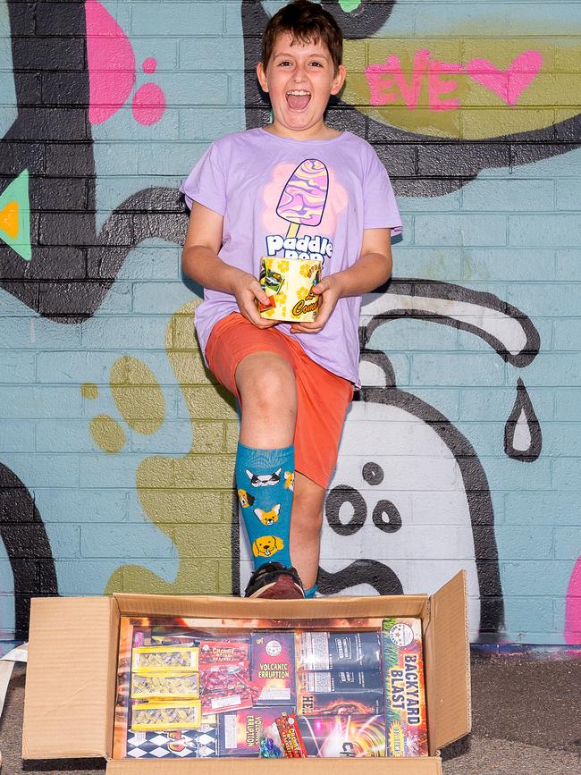 Will Bailey, 11 stocking up with fireworks ahead of an explosive night of fun on Territory Day. Picture: Pema Tamang Pakhrin