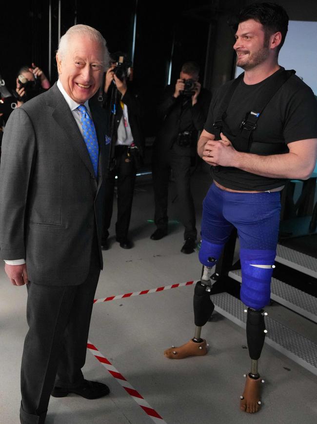 The King chatted with British parasport athlete, and former soldier-turned researcher, David Henson during a visit to the Centre for Injury Studies at Imperial College London. Picture: Kirsty Wigglesworth/Pool/AFP