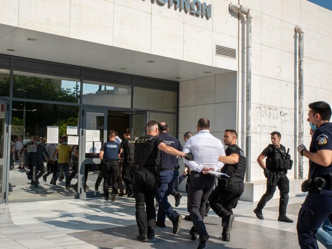 The scene outside an Athens court. Picture: Spyros Bakalis