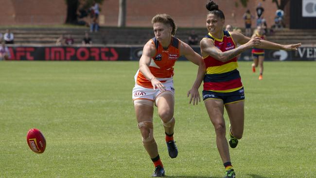 Pepa Randall nudges Crows player Stevie-Lee Thompson off the ball in a match in Adelaide.