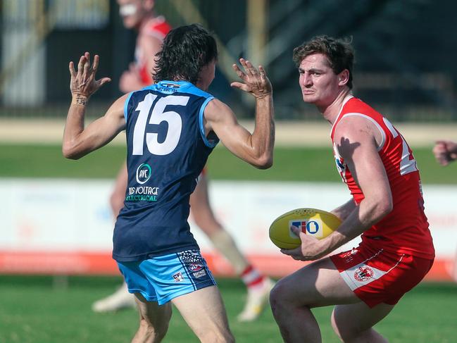 Scott Carlin sizes of his opposition for Waratah against Darwin Buffaloes in Round 2 of the 2022-23 NTFL season. Picture: Glenn Campbell