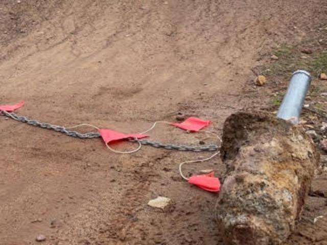 A damaged concrete bollard and chain at the Bare Creek Bike Park. Picture: Trail Care