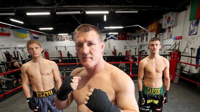 DAILY TELEGRAPH, April 14, 2022: Paul Gallen (centre) alongside Nikita Tszyu (left) and Harry Garside (right) pictured at the Bondi Boxing club in Waterloo. The three boxers will feature in the first ever triple-header boxing show for Main Event on May 11. Picture: Damian Shaw