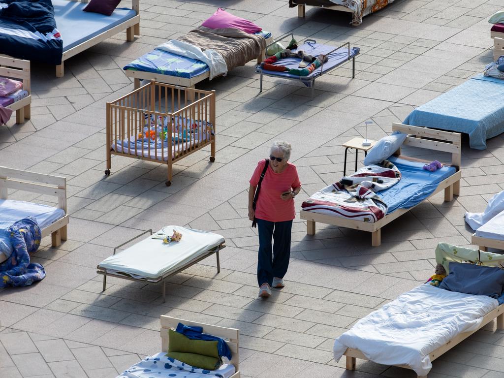 People visit The Empty Beds Installation. Picture: Getty